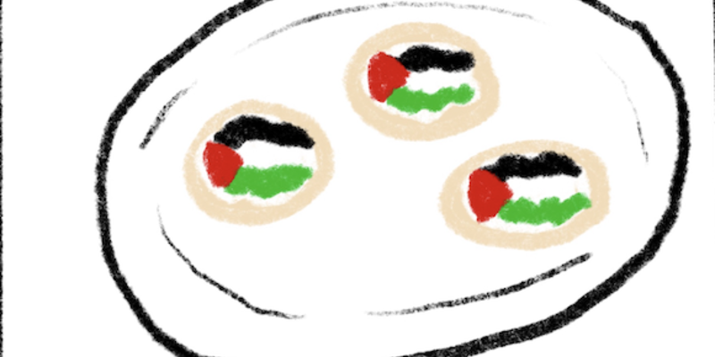 a plate of cookies decorated with the Palestinian flag